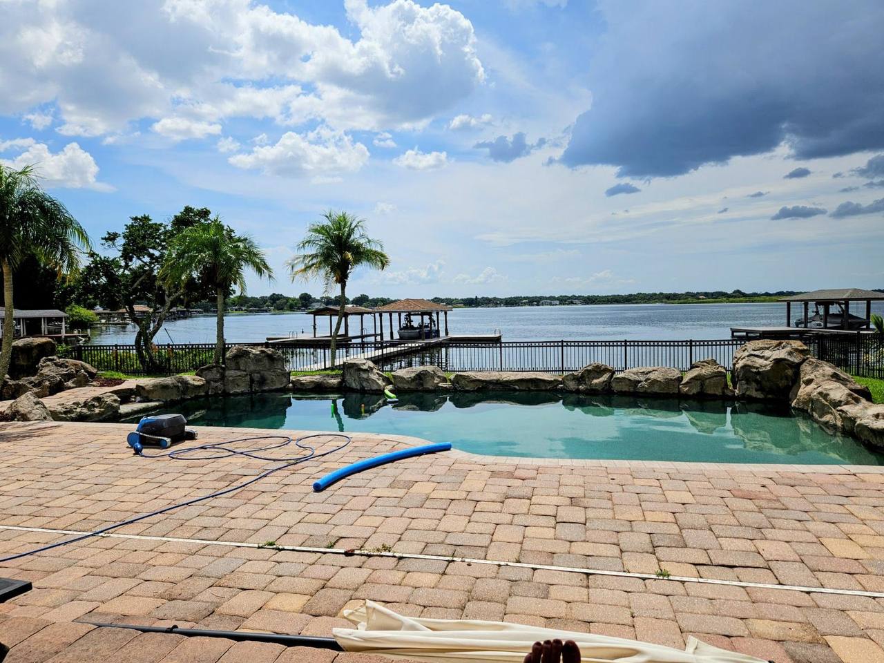 Pool with natural rock features before renovation